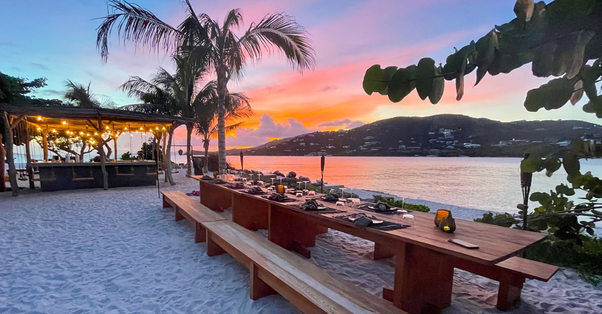 Sunset dinner table set on the beach at The Aerial, BVI