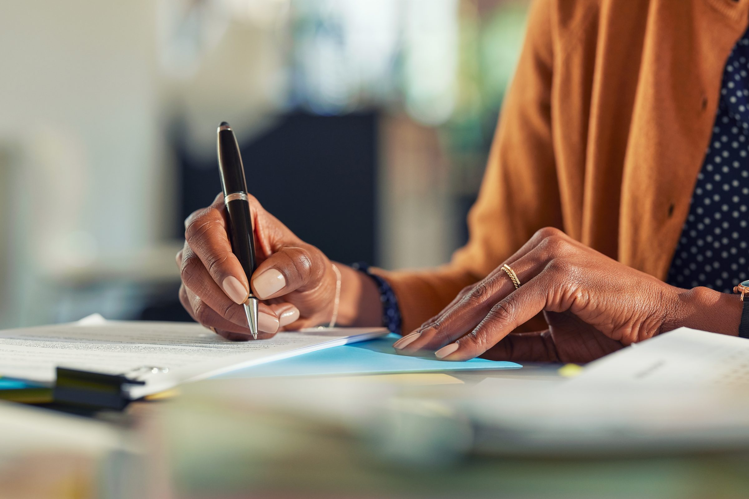 A legal professional signing case documents